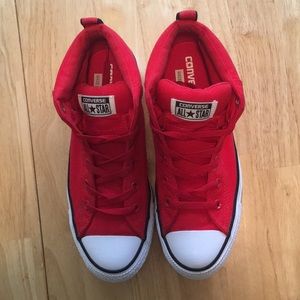 Red Ladies Chuck Taylor Converse boots.